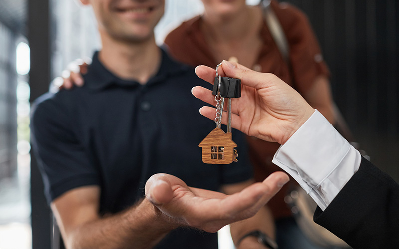 Family buy new house collecting keys