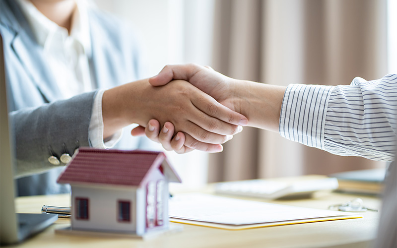 Handshake between real estate valuation companies.