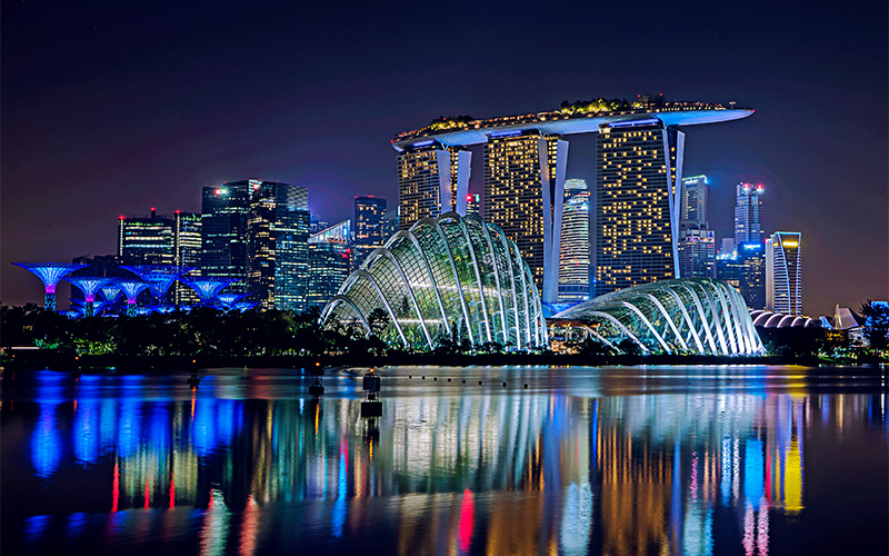 Singapore's cityscape at night, showcasing architectural excellence.
