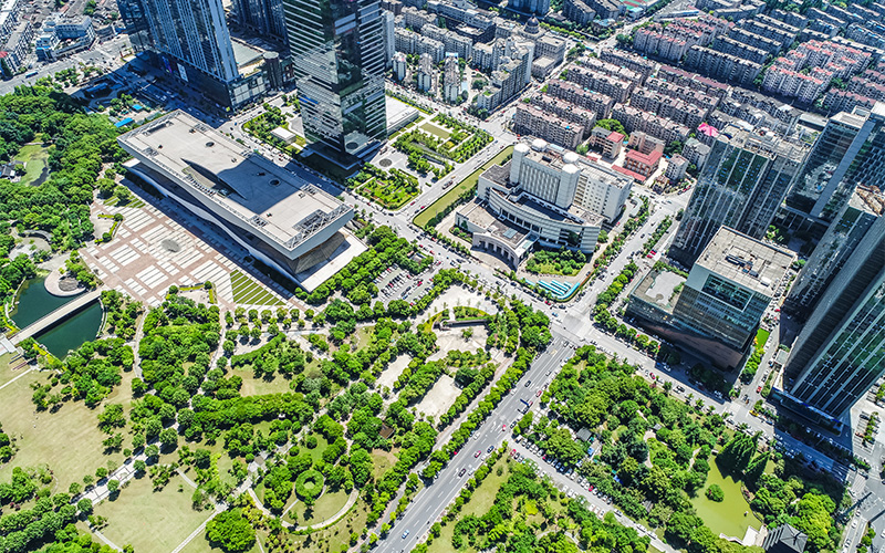Urban area with green spaces and buildings.