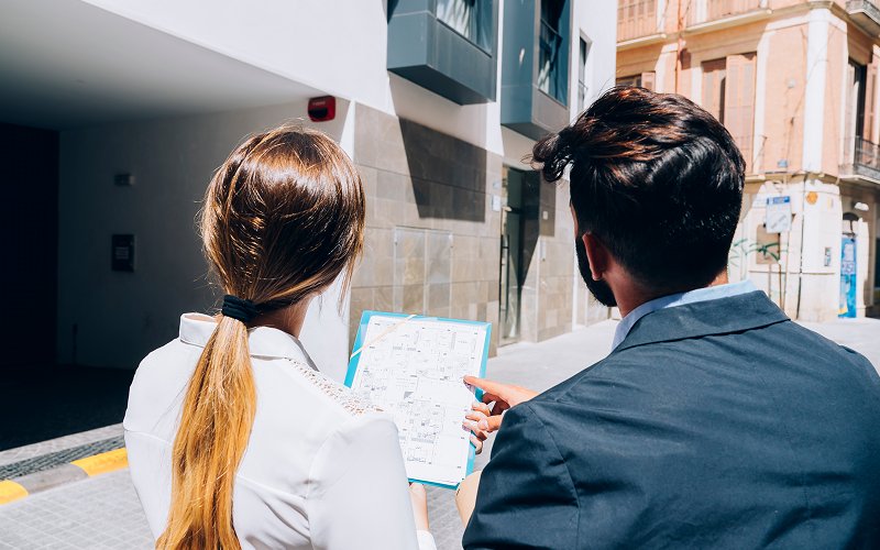 Real estate professionals conducting an on site property valuation inspection